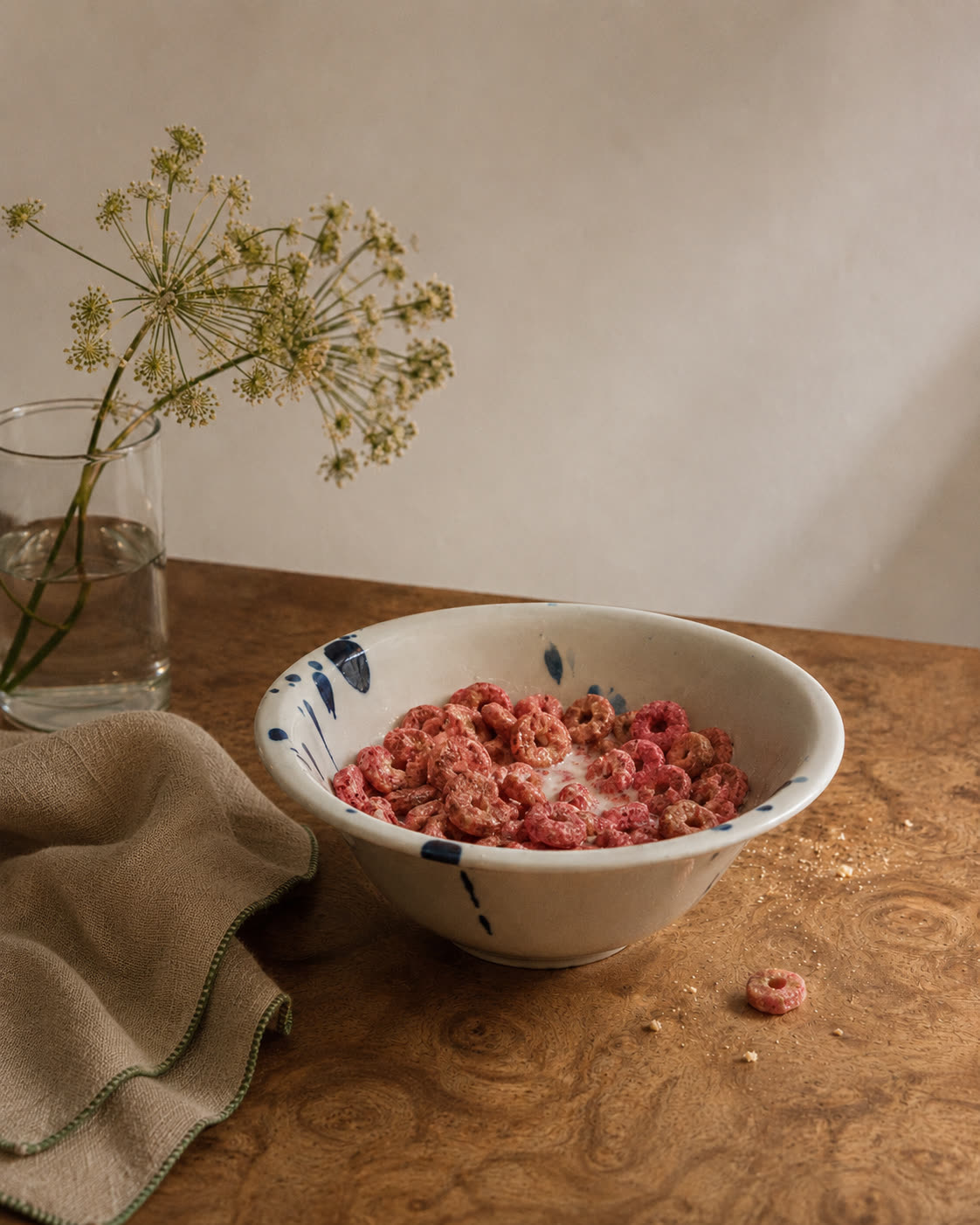 Pink cereal in a cobalt ceramic bowl